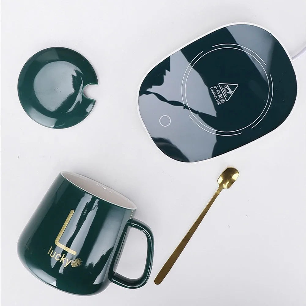 مج بورسلين حراري مزود بقاعدة تسخين ومعلقة ستانلس وشنطة هدايا