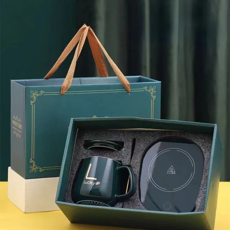 مج بورسلين حراري مزود بقاعدة تسخين ومعلقة ستانلس وشنطة هدايا