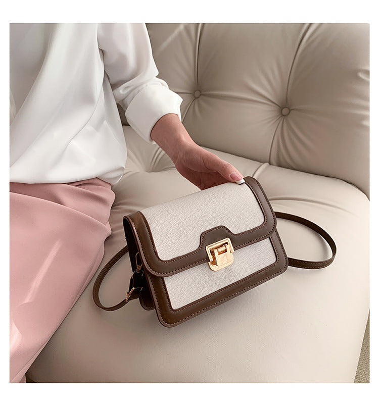 شنطة كروس جلد بتصميم أنيق بقفل ذهبي