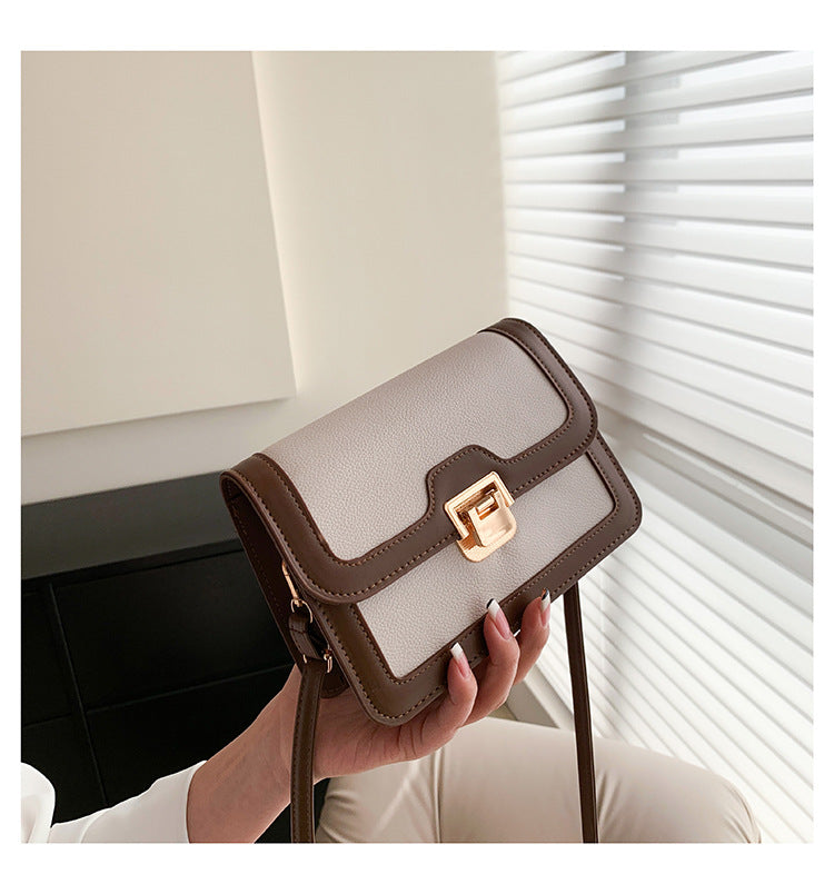 شنطة كروس جلد بتصميم أنيق بقفل ذهبي