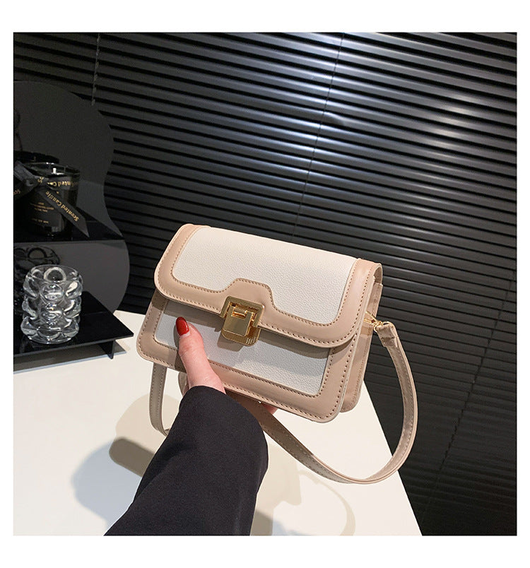 شنطة كروس جلد بتصميم أنيق بقفل ذهبي