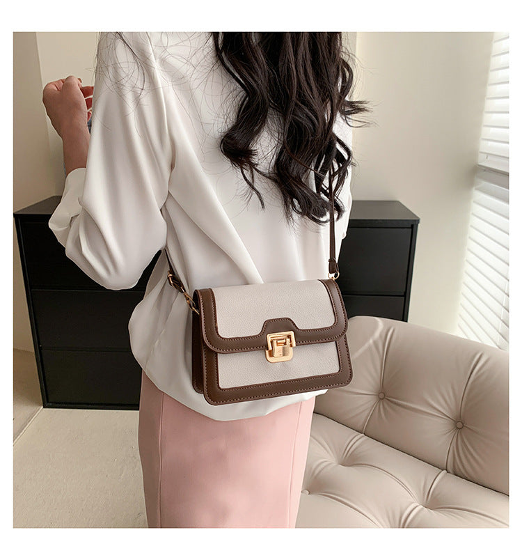 شنطة كروس جلد بتصميم أنيق بقفل ذهبي