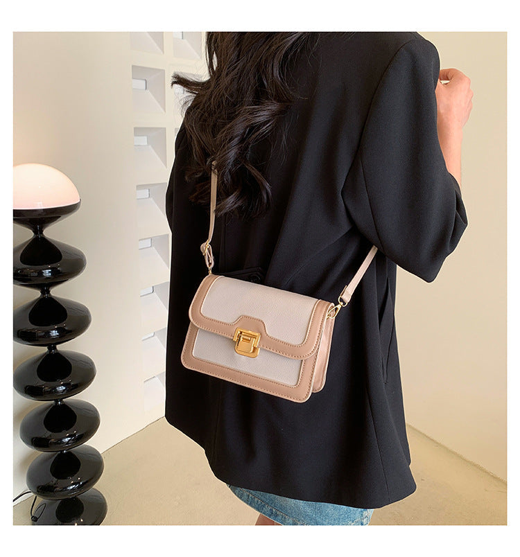 شنطة كروس جلد بتصميم أنيق بقفل ذهبي