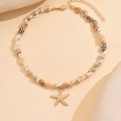 سلسلة خرز صدف طبيعي مع نجمة بحر ذهبية