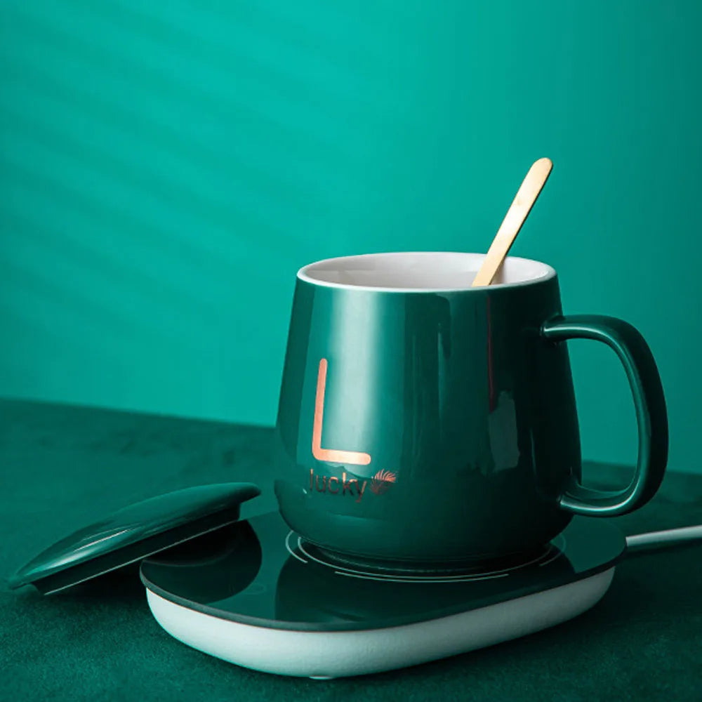 مج بورسلين حراري مزود بقاعدة تسخين ومعلقة ستانلس وشنطة هدايا