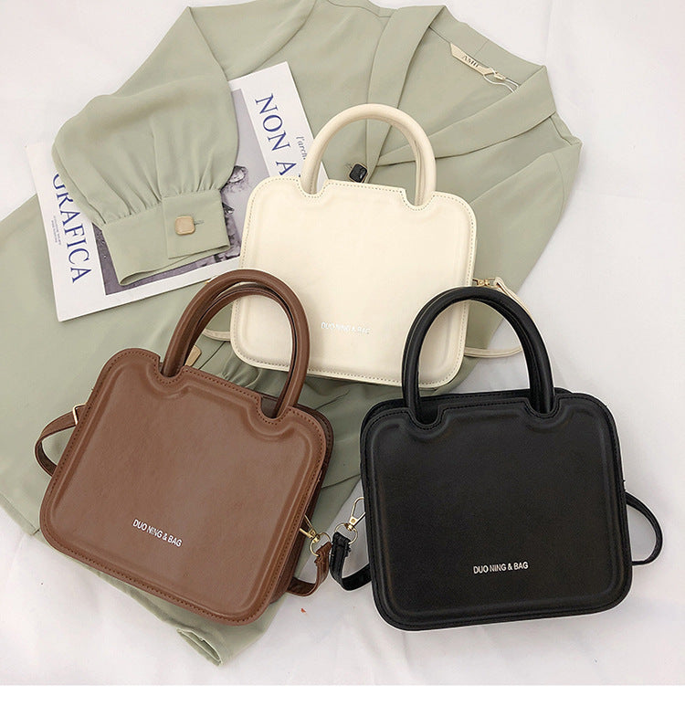 شنطة يد نسائية جلد معالج PA – تصميم أنيق وعصري