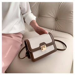 شنطة كروس جلد بتصميم أنيق بقفل ذهبي