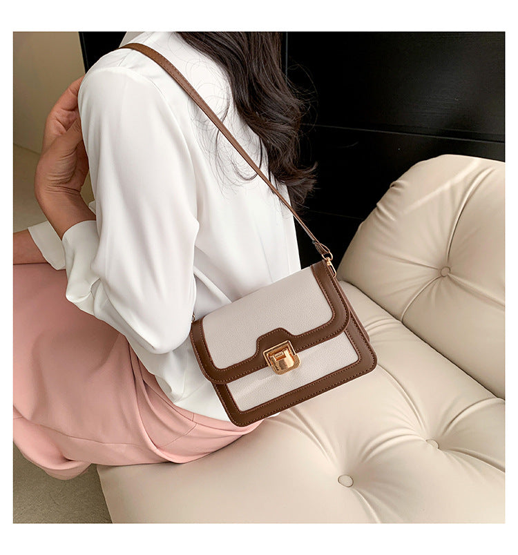 شنطة كروس جلد بتصميم أنيق بقفل ذهبي