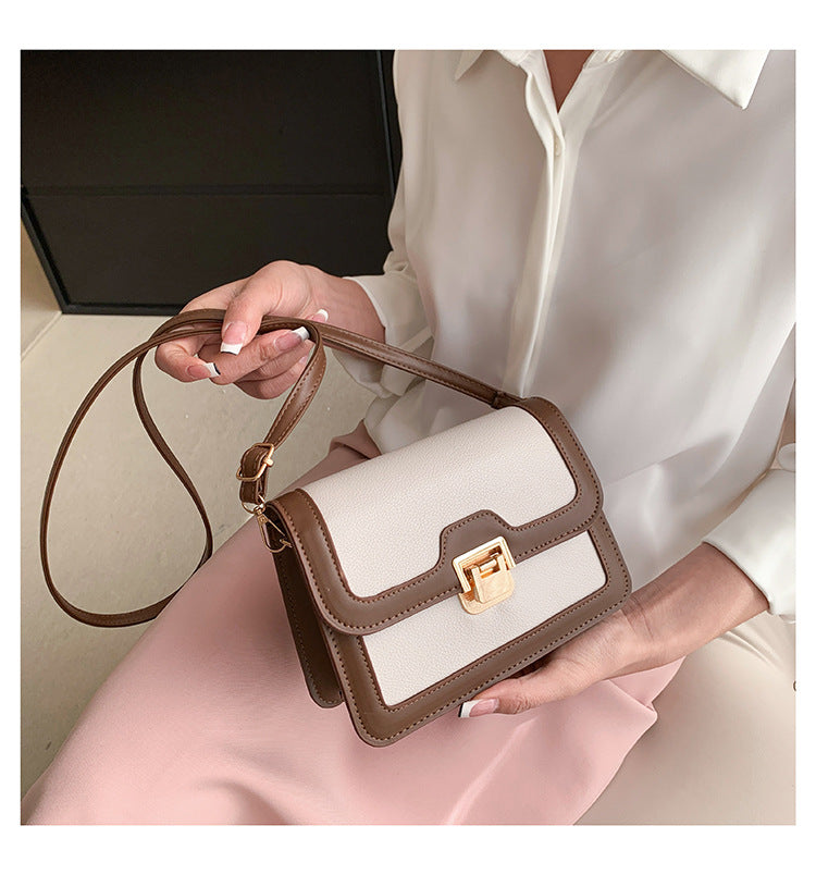 شنطة كروس جلد بتصميم أنيق بقفل ذهبي