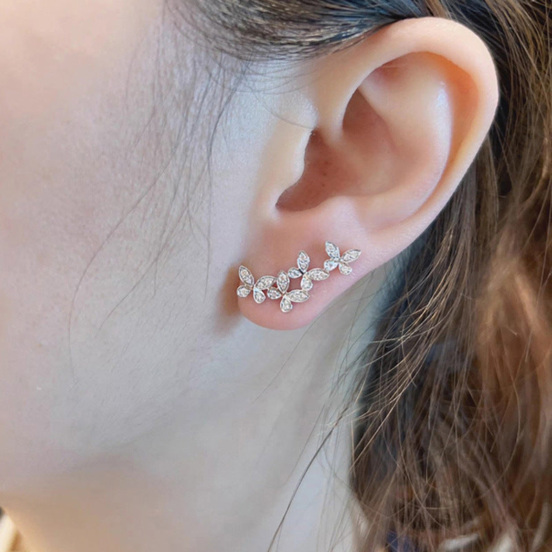 حلق أذن بتصميم فراشات مرصعة – ستايل بيرسينج أنيق ولمعان فاخر